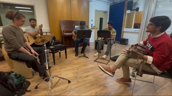 Bilal Khattak performing live in a cross-cultural musical collaboration in Birmingham.