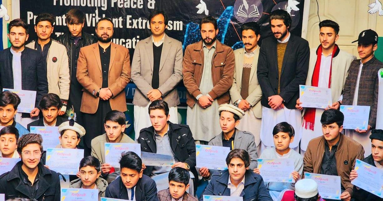 Students in Upper Dir perform at a peace and anti-extremism education session.