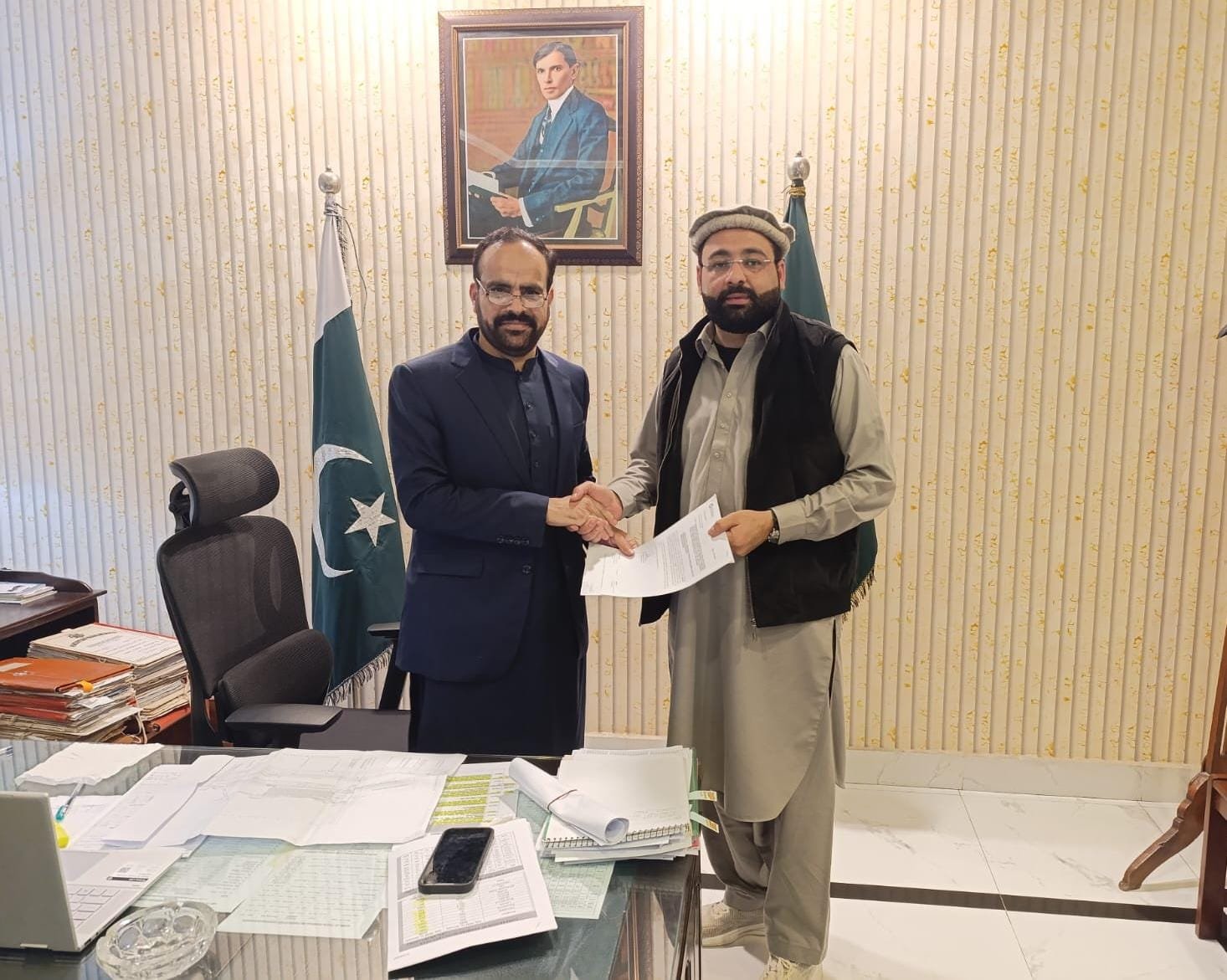 Hamza Khan hands over payment to clear way for the Nowshera gas pipeline project.