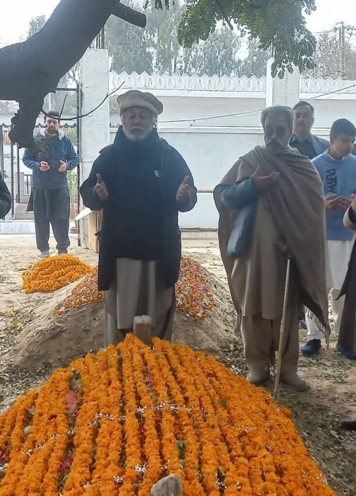 Family members offer prayers at the mausoleum of Al-Haj Zar Ali Khan in Pabbi on his 26th death anniversary.