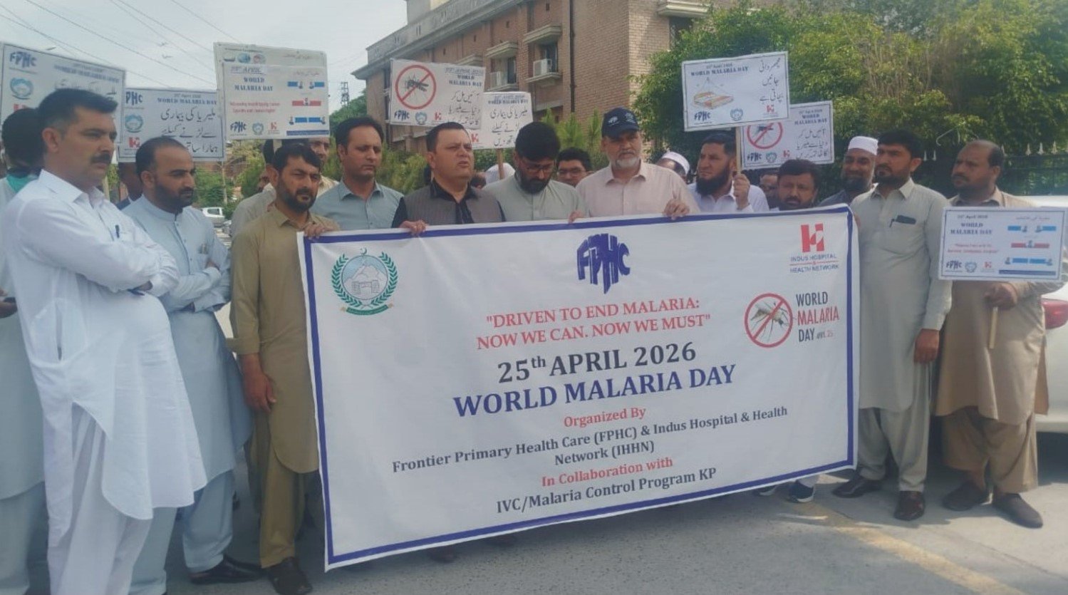 Health officials and residents take part in malaria awareness walk in Mardan on World Malaria Day.