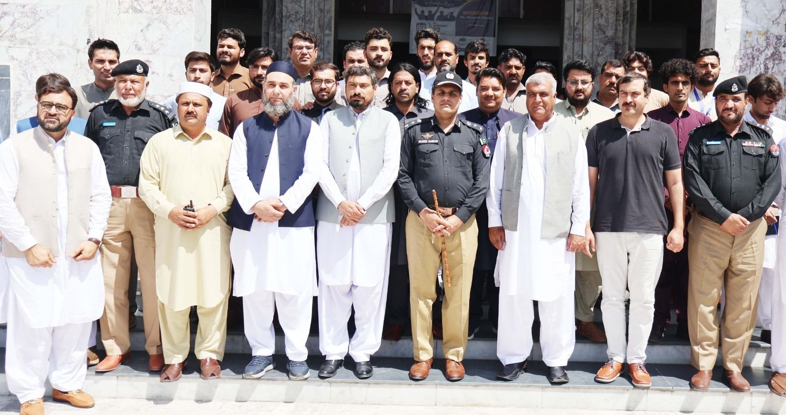 DPO Masood Ahmad speaking to students at Abdul Wali Khan University Mardan about drug eradication and digital addiction.